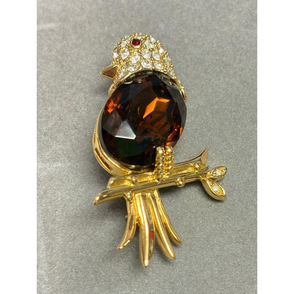 Vintage Nolan Miller Gold Tone Bird Brooch Rhinestone Eyes Amber Color Gem Body